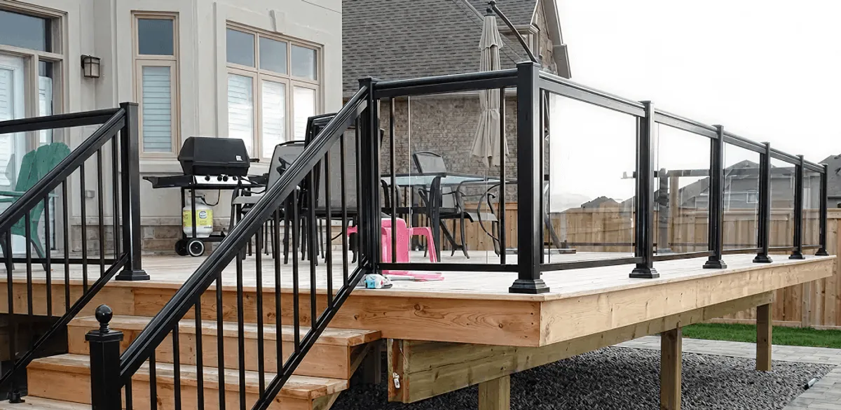 Handrail installation on a deck staircase for safety and code compliance in Overland Park, KS